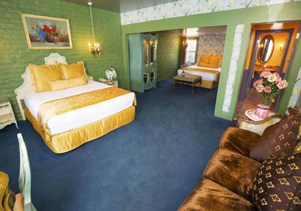 a hotel room with a bed and a couch at Madonna Inn in San Luis Obispo