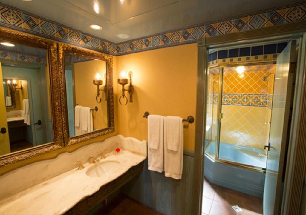 a bathroom with a tub and a sink and a shower at Madonna Inn in San Luis Obispo