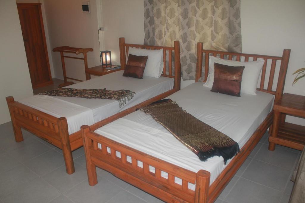 Postel nebo postele na pokoji v ubytování Privacy Resort - Koh Chang