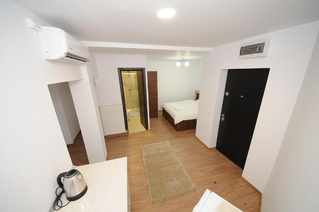 Postel nebo postele na pokoji v ubytování Citadel Aparthotel