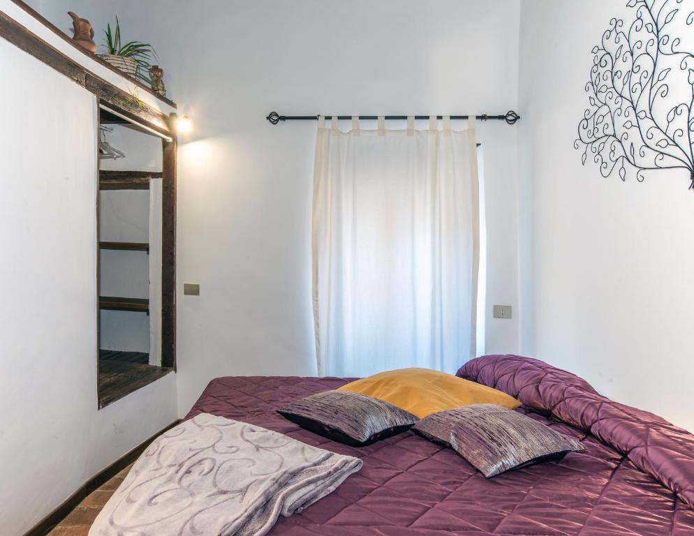 Posteľ alebo postele v izbe v ubytovaní Casa Roma