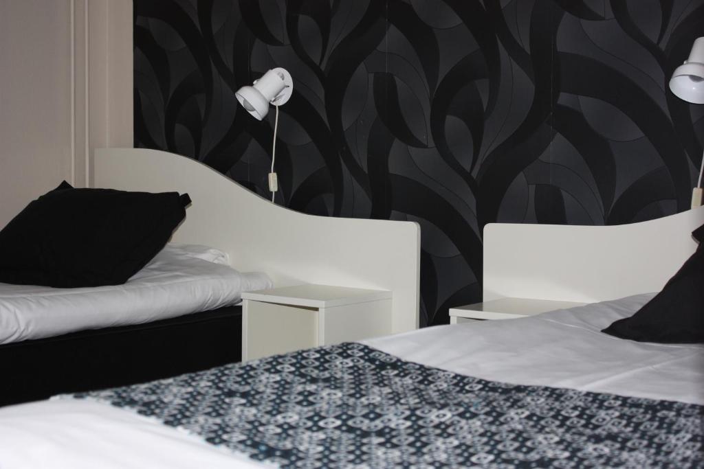Postel nebo postele na pokoji v ubytování Hotell Angöringen