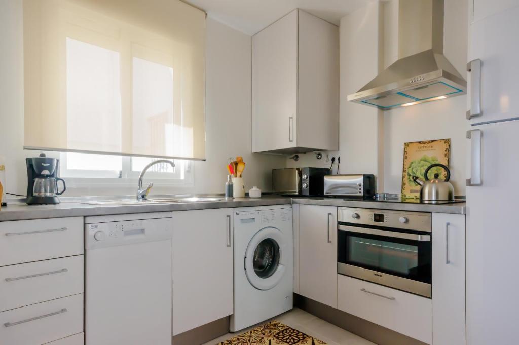 Kuchyň nebo kuchyňský kout v ubytování Apartamento Moran