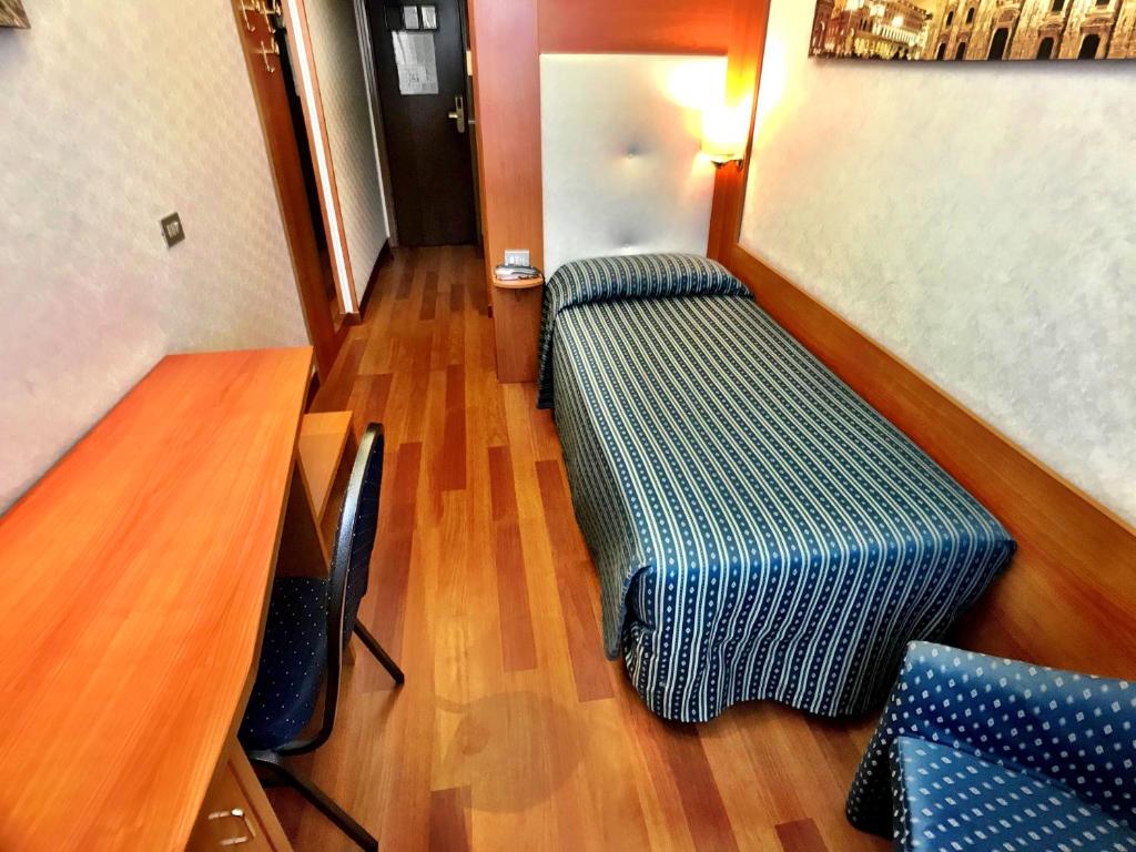 Łóżko lub łóżka w pokoju w obiekcie Hotel Mec