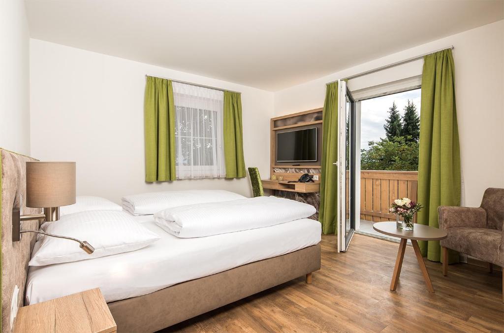 Posteľ alebo postele v izbe v ubytovaní Hotel & Restaurant Rupertigau