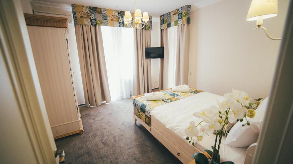 Postel nebo postele na pokoji v ubytování Svityaz Resort
