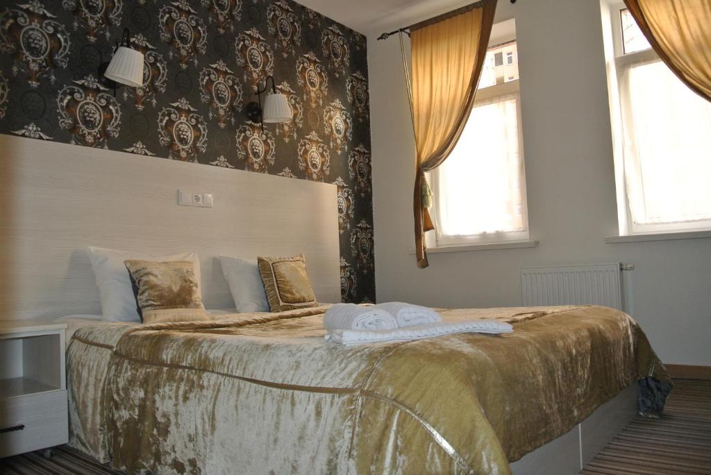 Postel nebo postele na pokoji v ubytování Mini Hotel on Poznyaky