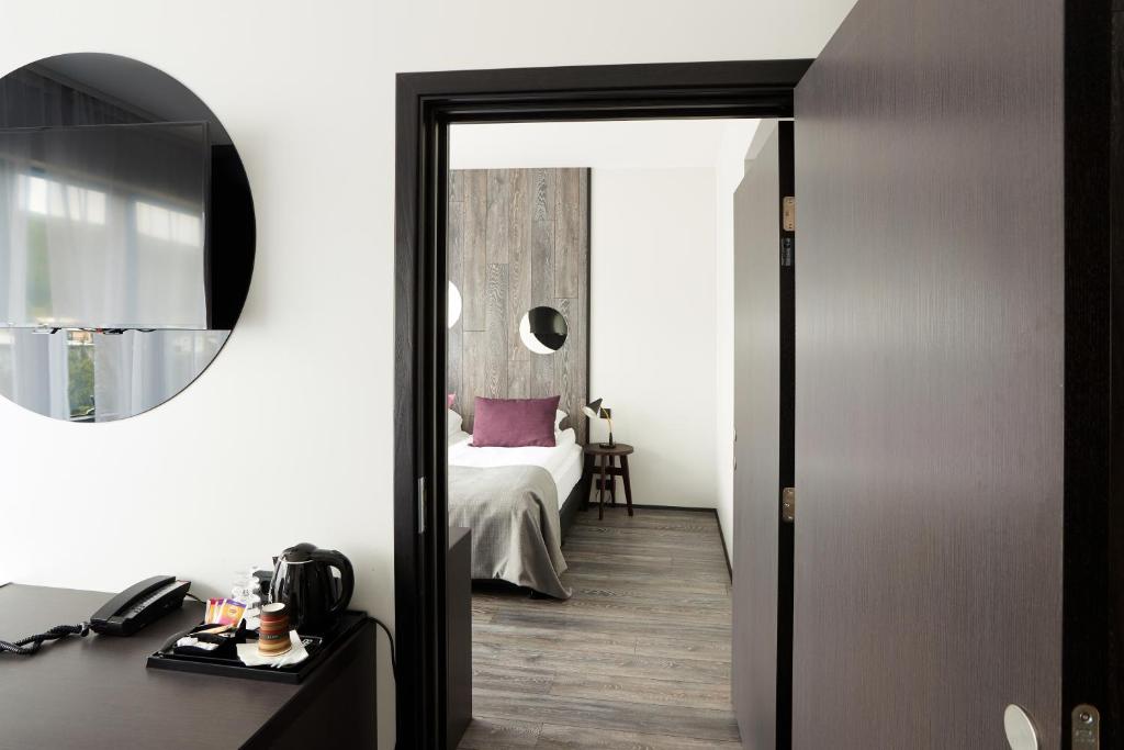 Postel nebo postele na pokoji v ubytování Fosshotel Husavik