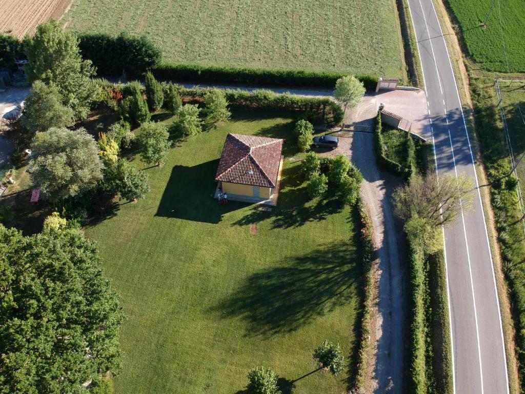 an aerial view of a house in a field with a road at VIGORSO 41 COUNTRY HOUSE in Budrio