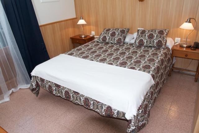 Postel nebo postele na pokoji v ubytování Hotel Comapedrosa