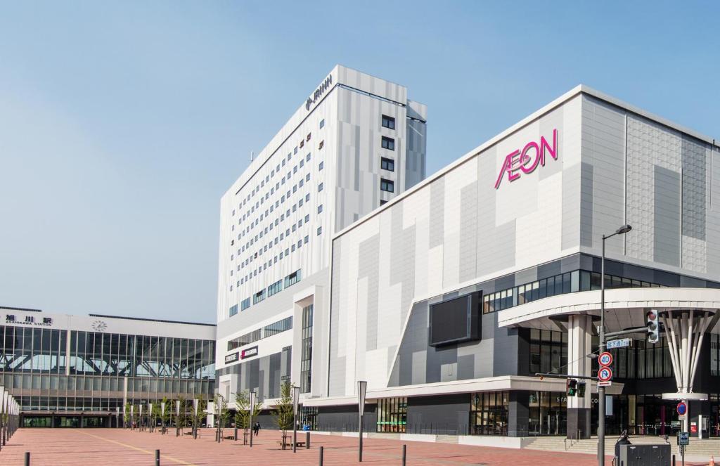 a large building with a fedex sign on it at JR Inn Asahikawa in Asahikawa