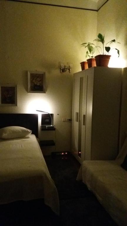 Postel nebo postele na pokoji v ubytování 12 Residence Cotroceni