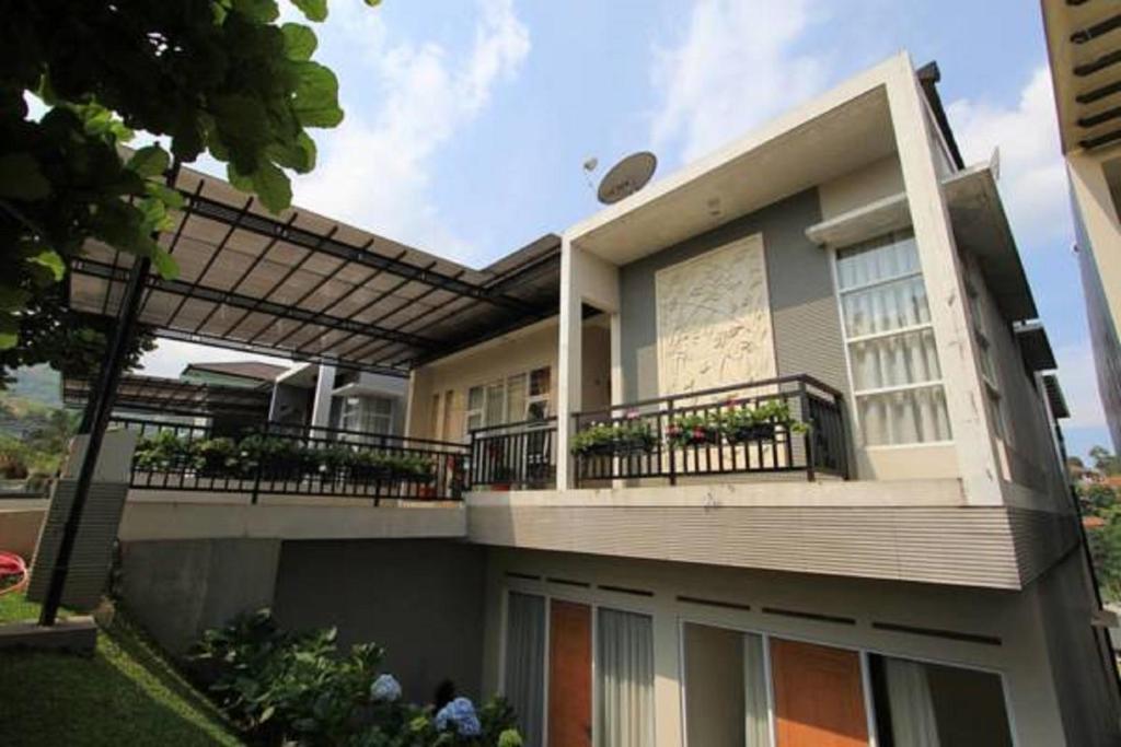 a large house with balconies on the side of it at Springhill Villa Syariah in Bandung