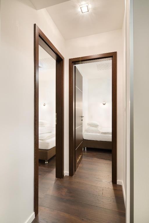 Posteľ alebo postele v izbe v ubytovaní Paulay Downtown Apartments