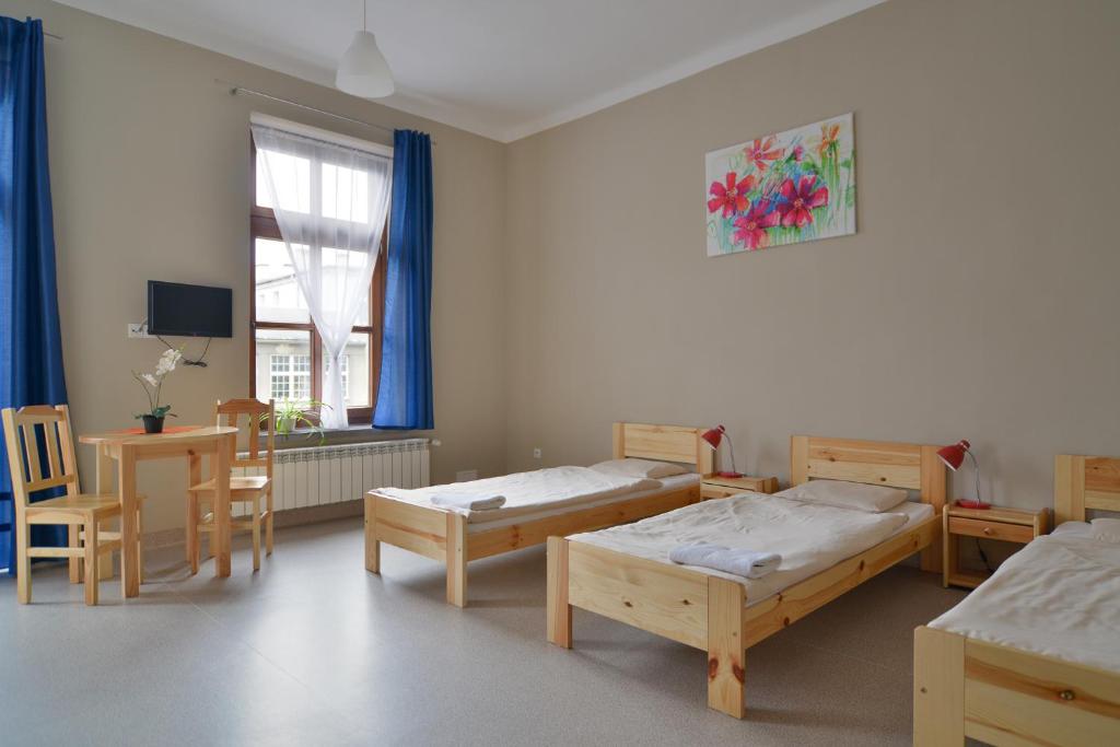 Postel nebo postele na pokoji v ubytování Dom Turysty PTTK w Bielsku - Białej
