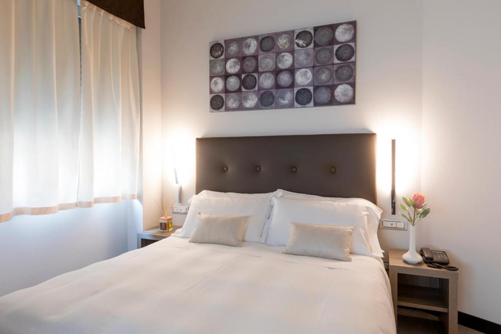 Postel nebo postele na pokoji v ubytování Hotel Mentana, by R Collection Hotels