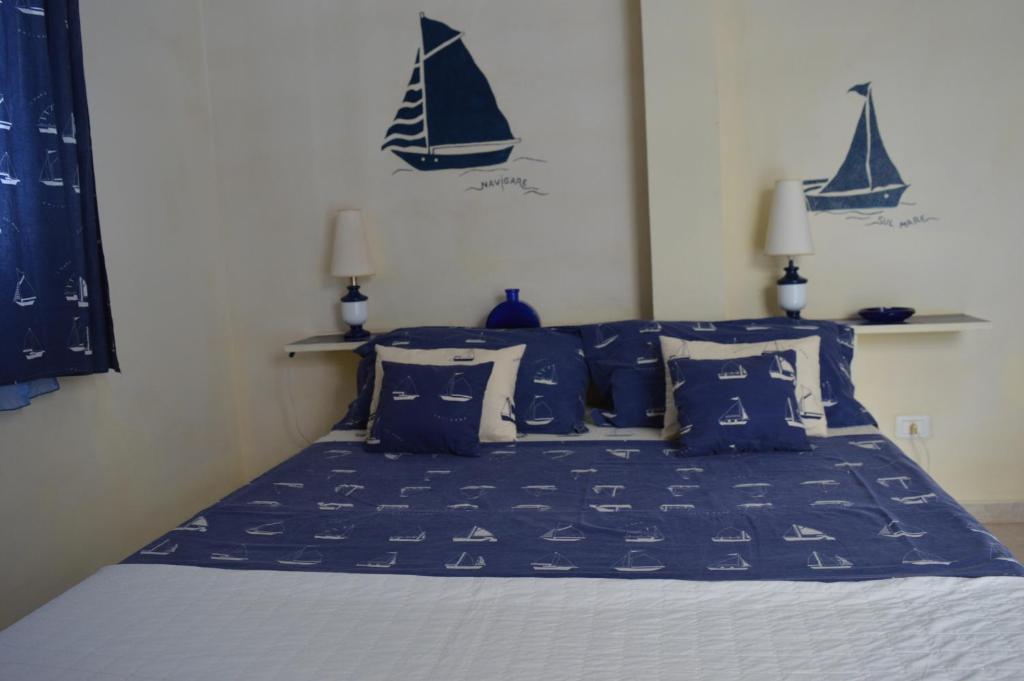 Postel nebo postele na pokoji v ubytování Yacht Club Sal