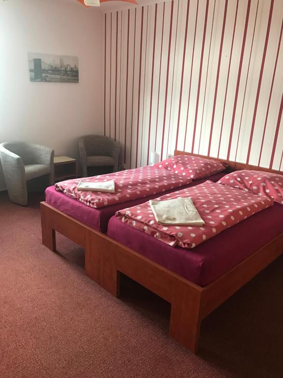Postel nebo postele na pokoji v ubytování Penzion Na Kopečku