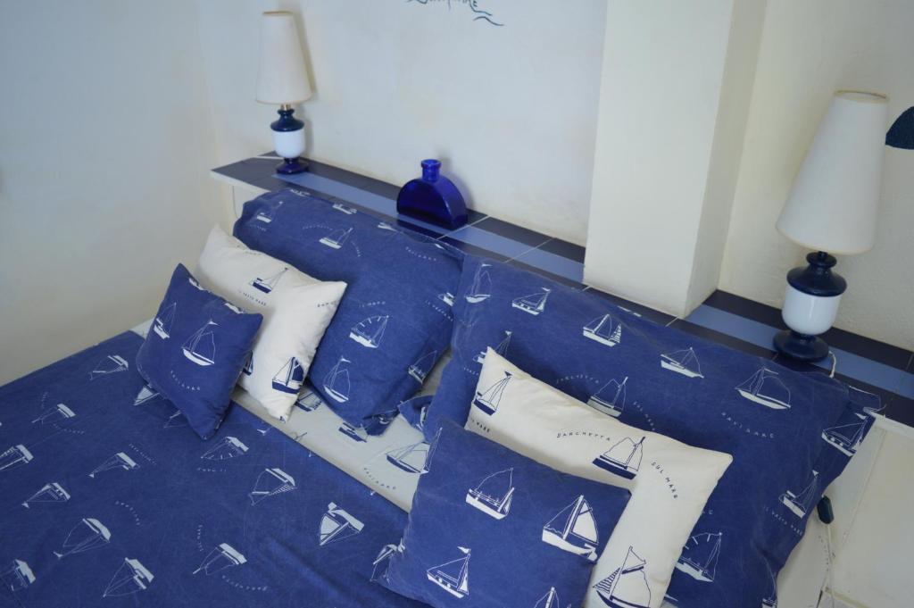 Postel nebo postele na pokoji v ubytování Yacht Club Sal