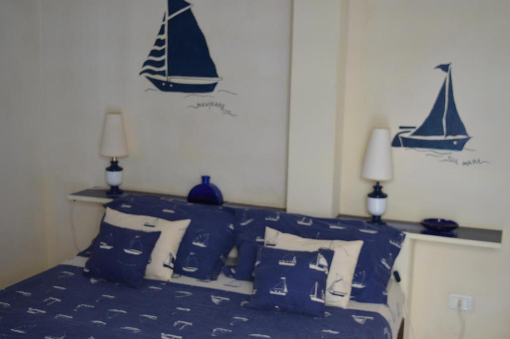Postel nebo postele na pokoji v ubytování Yacht Club Sal