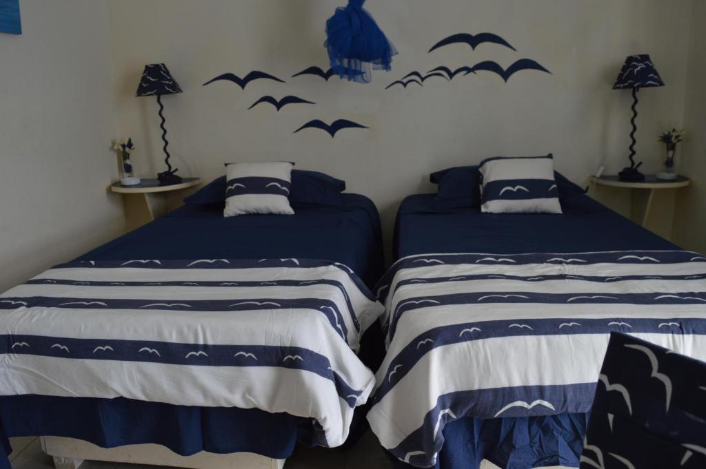 Postel nebo postele na pokoji v ubytování Yacht Club Sal