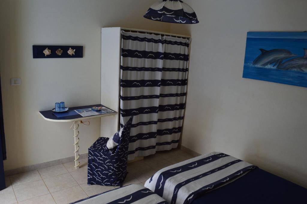 Postel nebo postele na pokoji v ubytování Yacht Club Sal