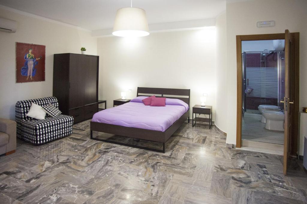 Posteľ alebo postele v izbe v ubytovaní Pompei Gryllus