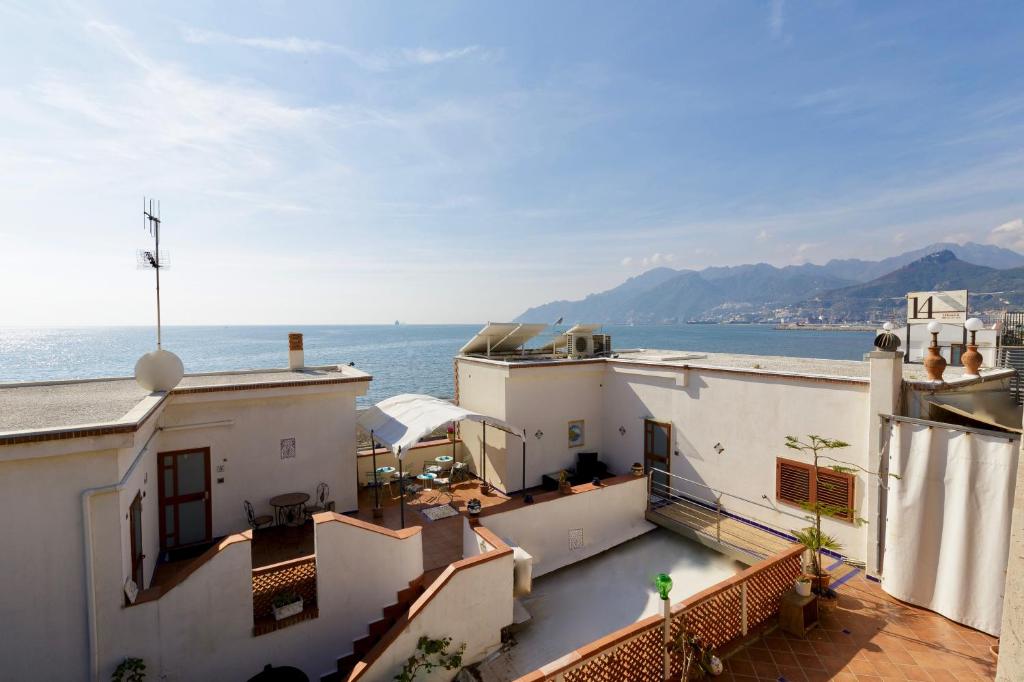 a view of the ocean from the balcony of a building at 14 Leoni in Salerno