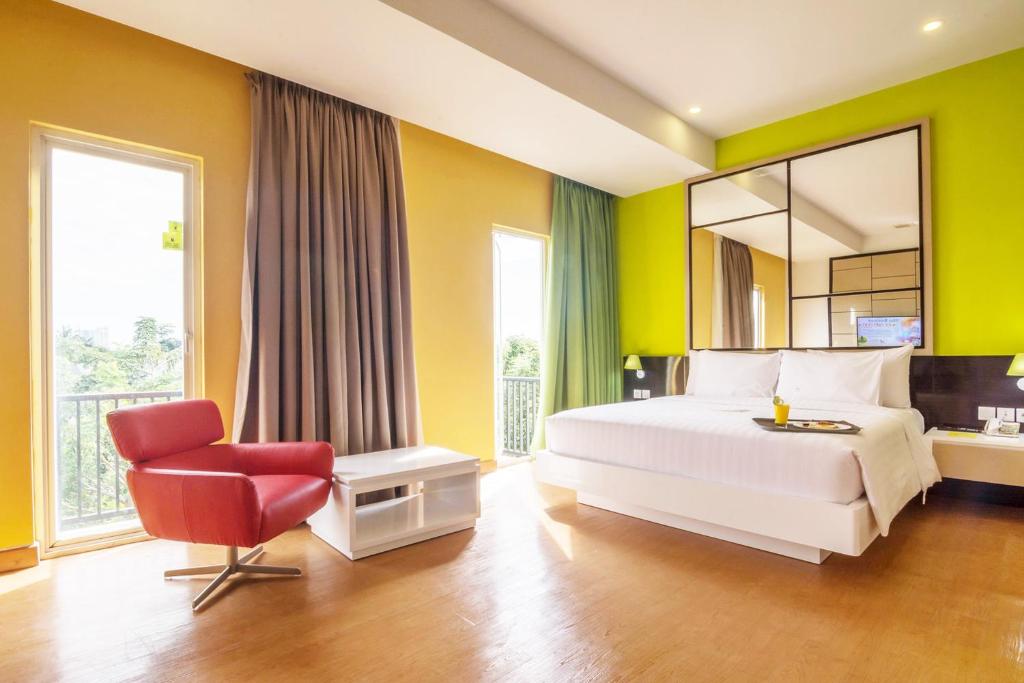 Postel nebo postele na pokoji v ubytování MaxOneHotels at Resort Makassar