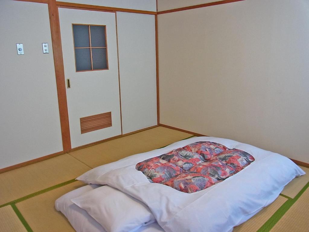 Postel nebo postele na pokoji v ubytování Hotel Ohta