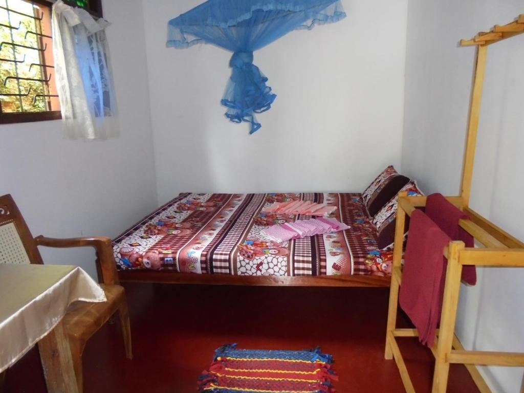 Postel nebo postele na pokoji v ubytování Sun Bird Eco Guest Mirissa
