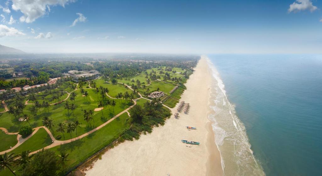 an aerial view of a beach and the ocean at Taj Exotica Resort & Spa, Goa in Benaulim
