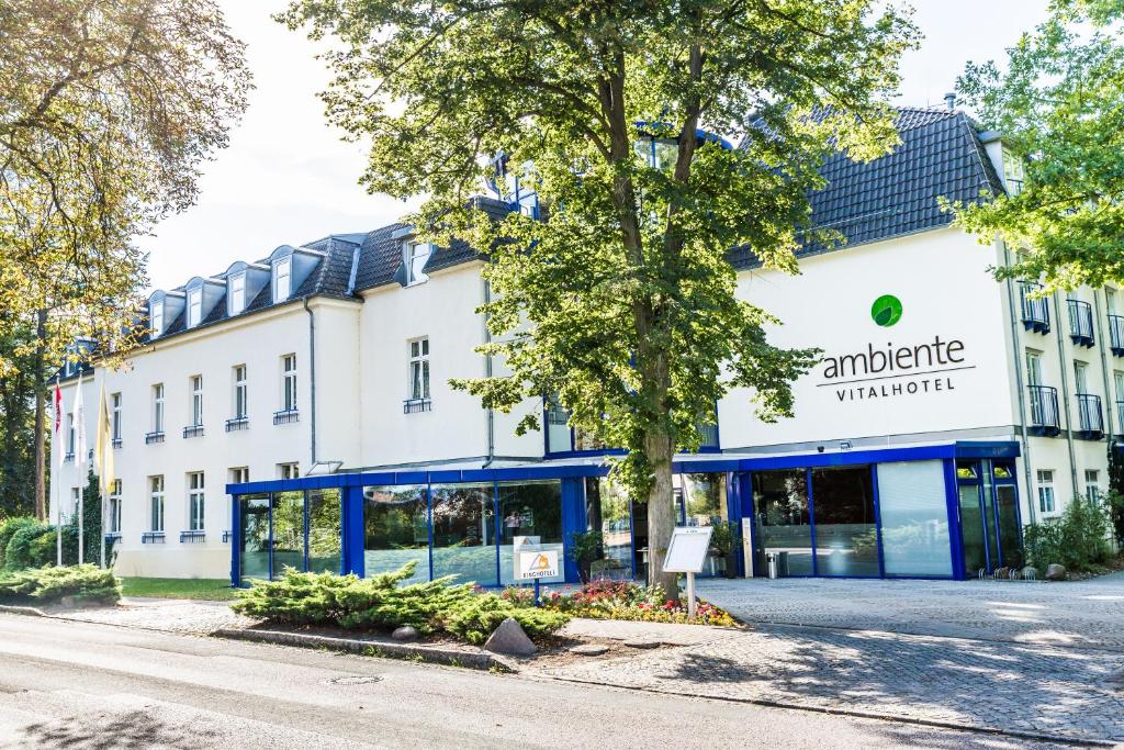 a building with an antwerp warehouse on the street at Ringhotel VITALHOTEL ambiente in Bad Wilsnack