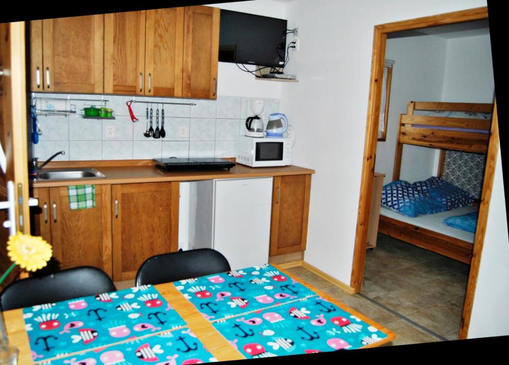 Postel nebo postele na pokoji v ubytování Kwiatu Paproci