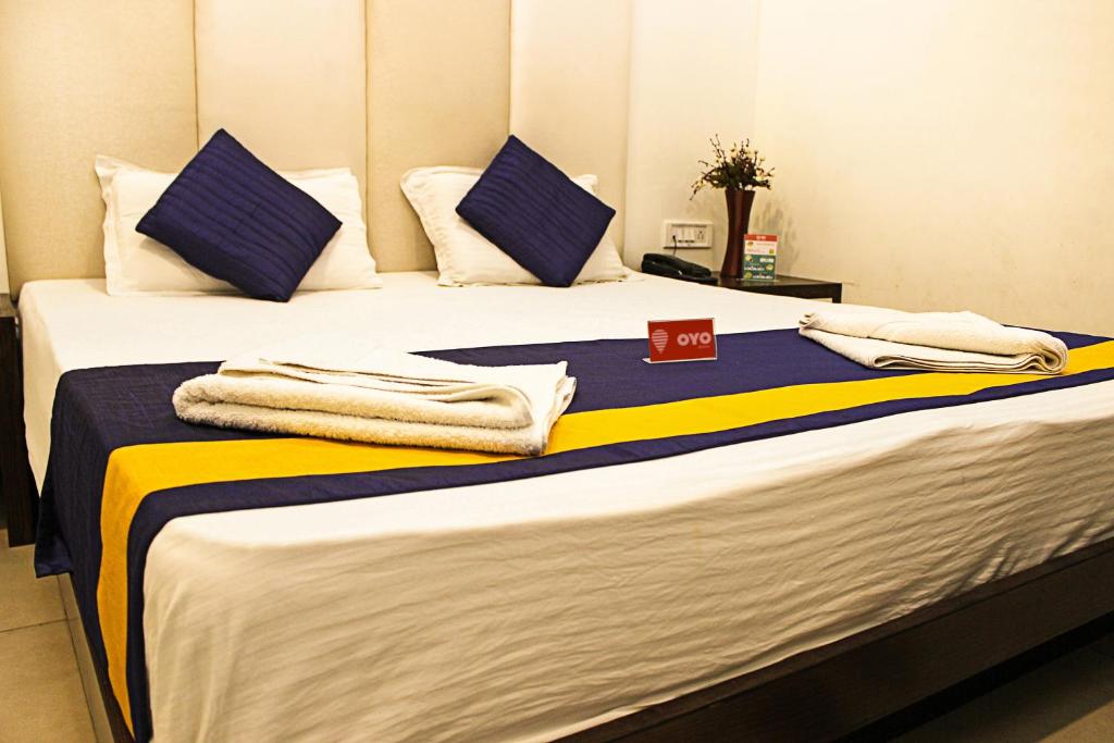 Postel nebo postele na pokoji v ubytování Hotel Golden Wings