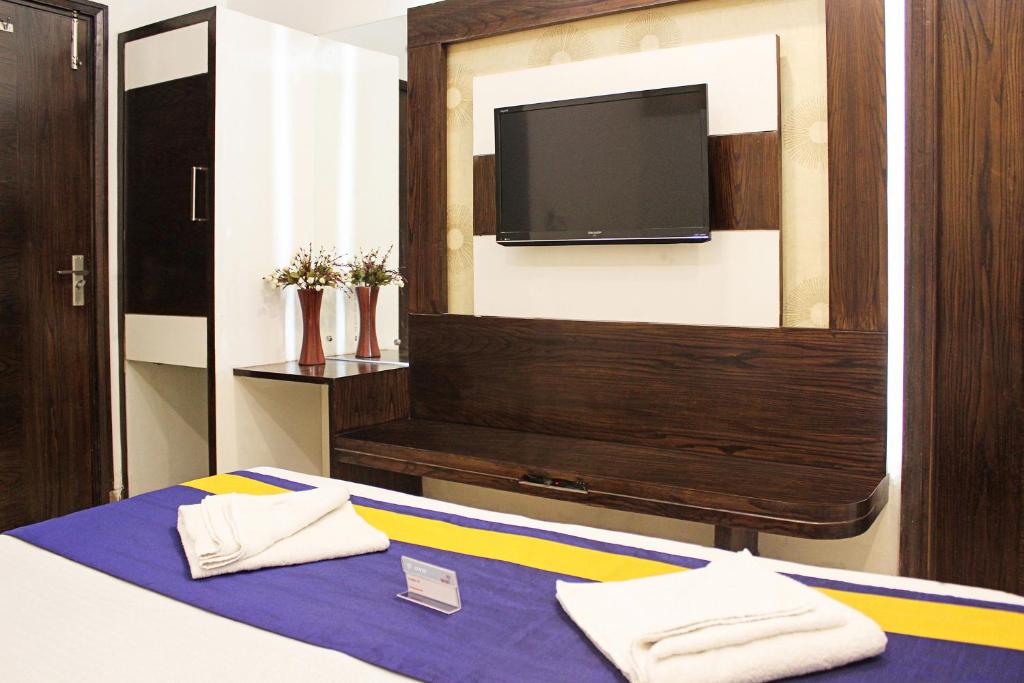 Postel nebo postele na pokoji v ubytování Hotel Golden Wings