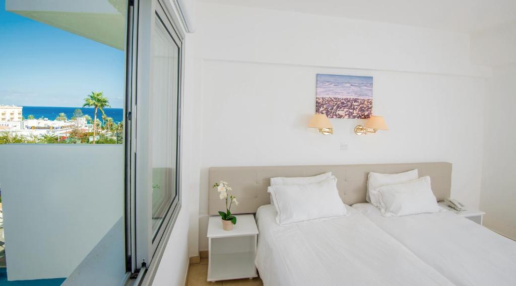 Postel nebo postele na pokoji v ubytování Alva Hotel Apartments