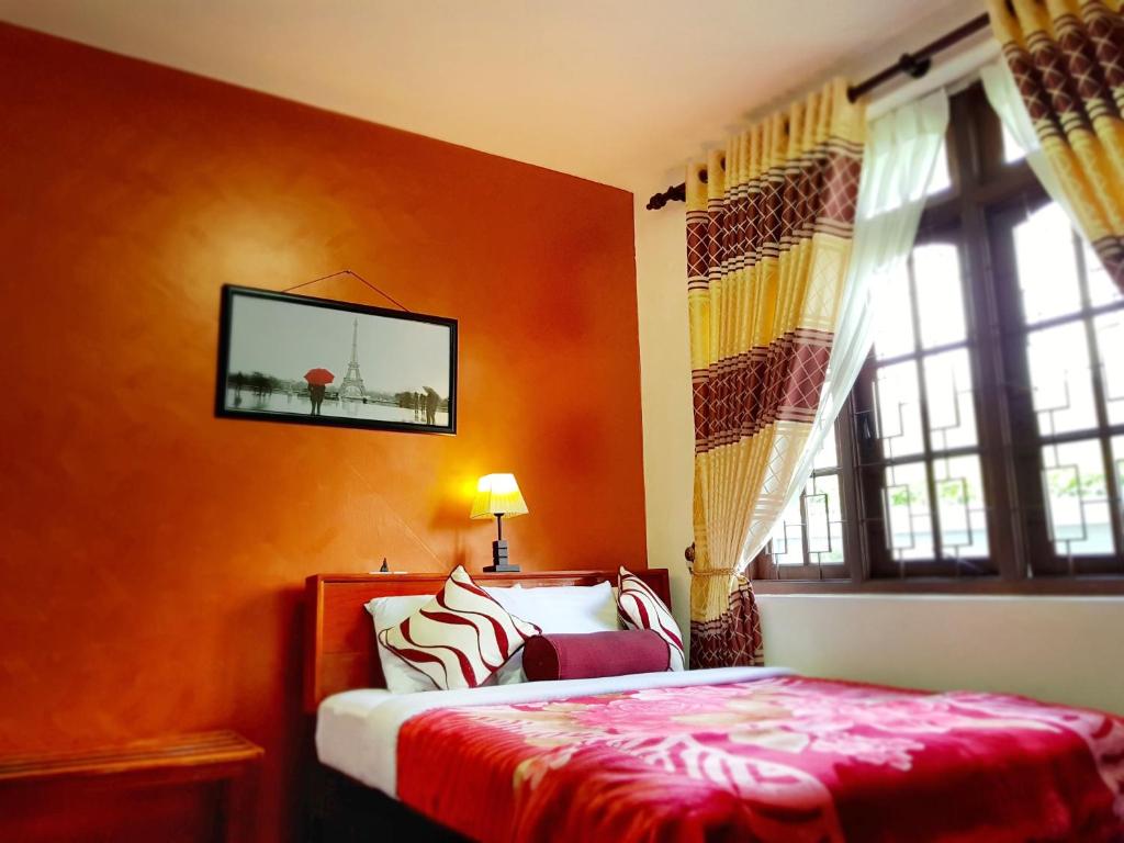 Postel nebo postele na pokoji v ubytování Nuwara Eliya Hills Rest