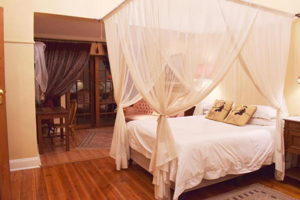 Ένα ή περισσότερα κρεβάτια σε δωμάτιο στο Lockerbie Lodge