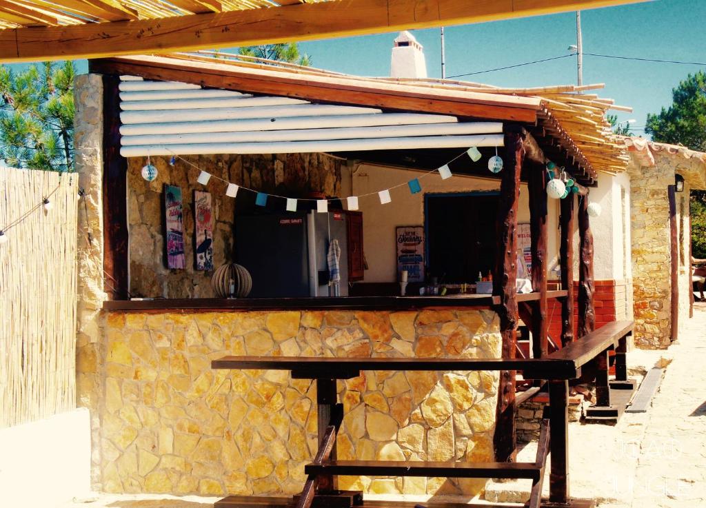 a building with a picnic table in front of it at João Jungle in Açafora