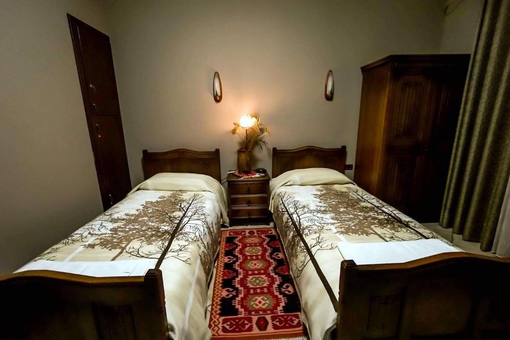 Postel nebo postele na pokoji v ubytování Real Scampis Hotel