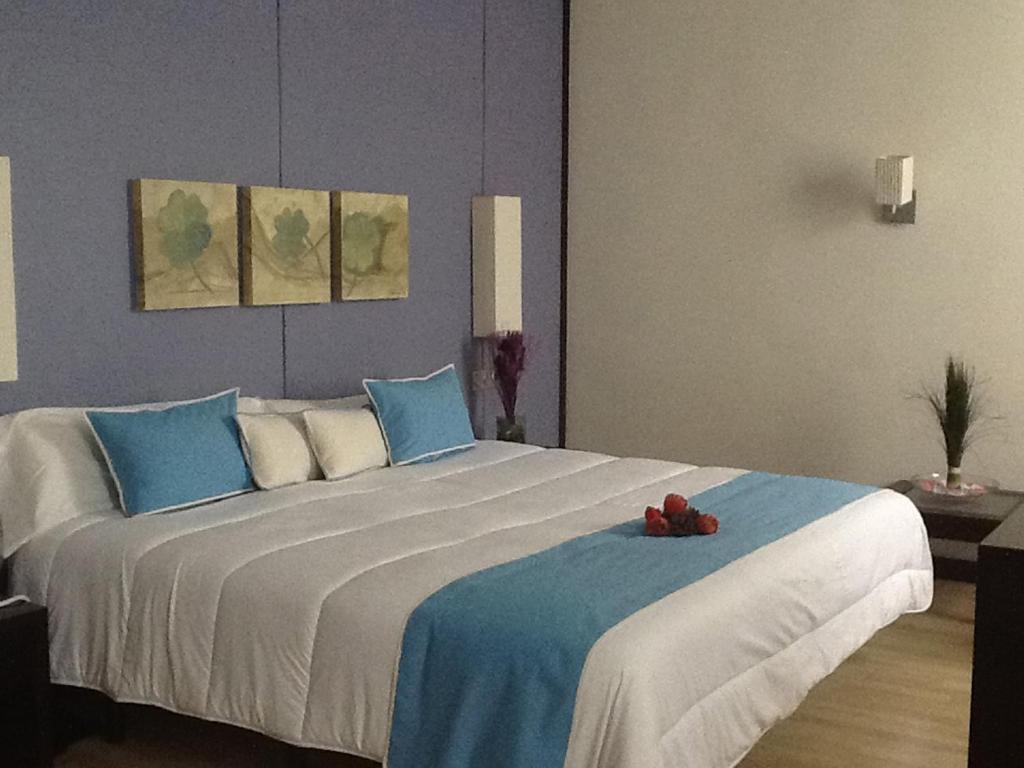 Postel nebo postele na pokoji v ubytování Hotel Puerta de Ocaña
