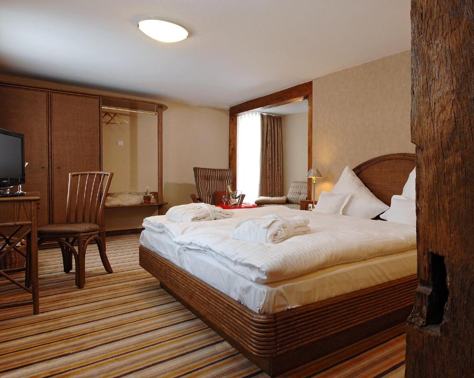 En eller flere senger på et rom på Gästehaus Dorf-Alm