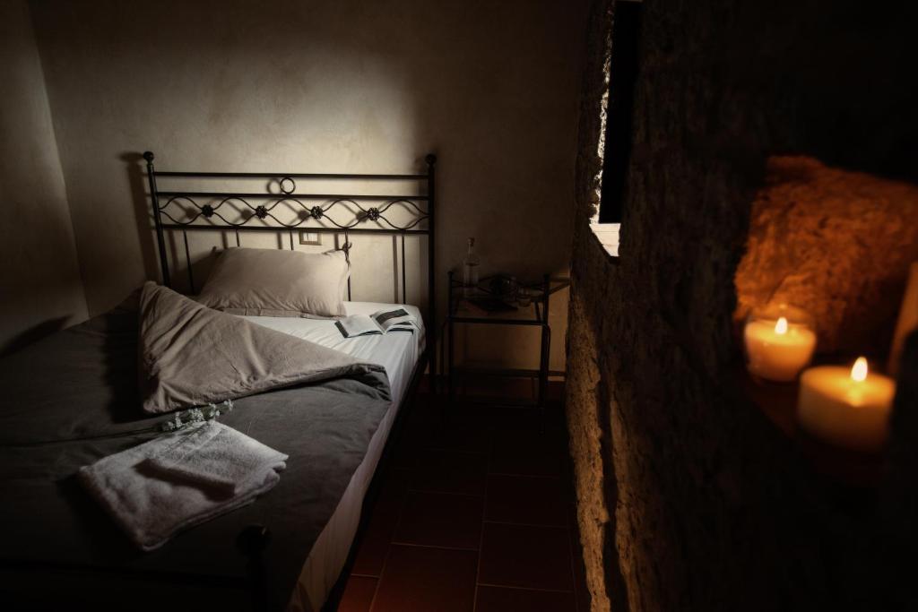Postel nebo postele na pokoji v ubytování Monastero Di Sant'Erasmo