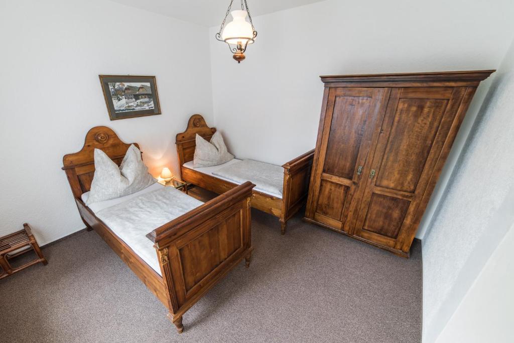 Postel nebo postele na pokoji v ubytování Valašský Hotel a Pivní lázně OGAR