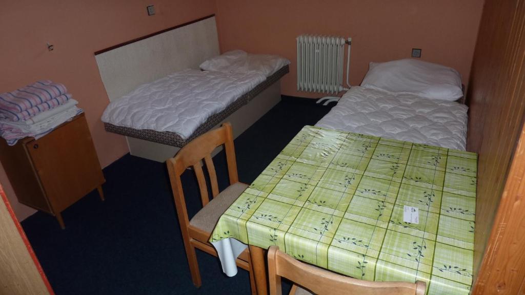 Postel nebo postele na pokoji v ubytování Penzion Tendr