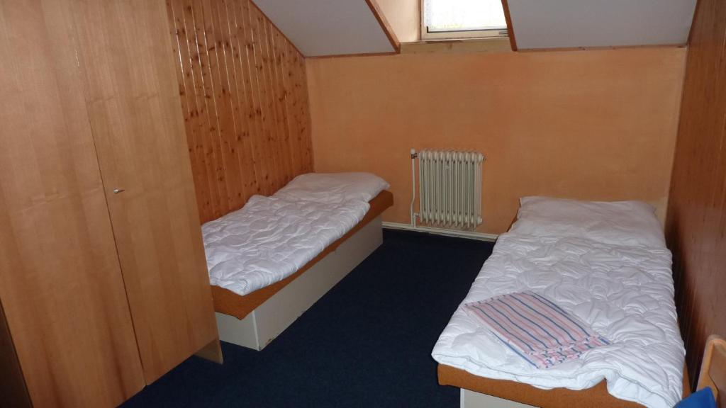 Postel nebo postele na pokoji v ubytování Penzion Tendr