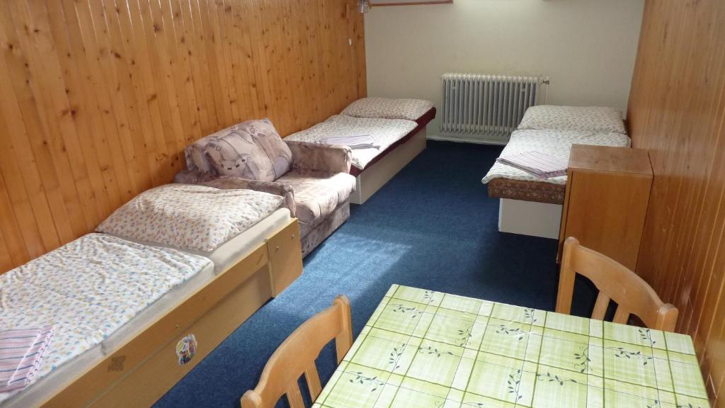 Postel nebo postele na pokoji v ubytování Penzion Tendr
