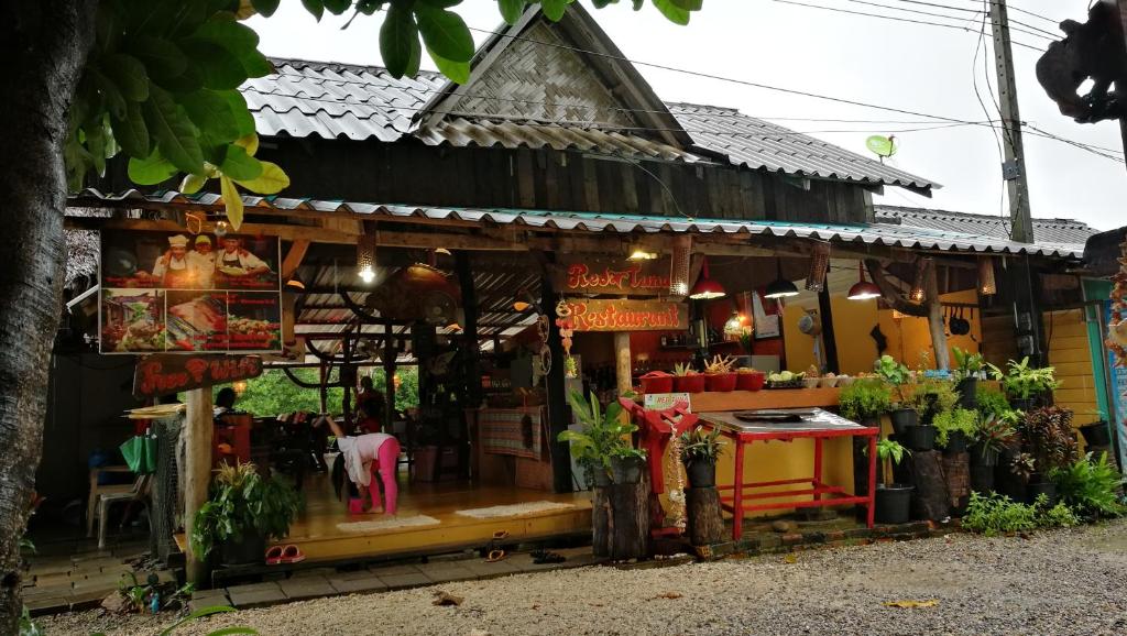 a building with a store in front of it at PP Red Tuna Hut in Phi Phi Don