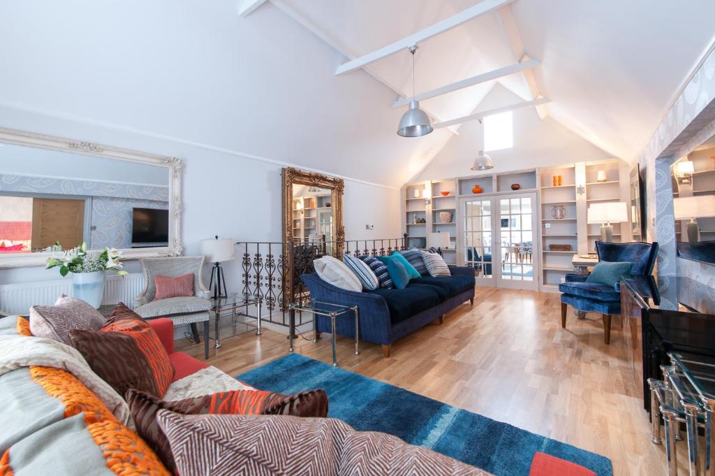 a living room with a couch and a table at Suites at number Ten in Broadstairs